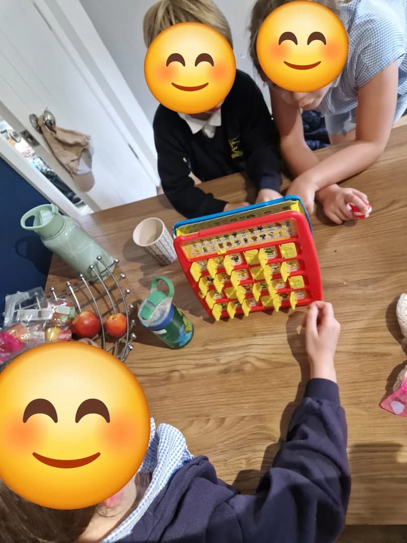 A friendly game of Connect 4 around the table