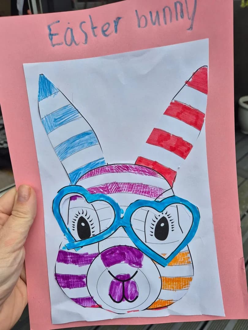 A bright Easter bunny artwork in pink, blue and orange